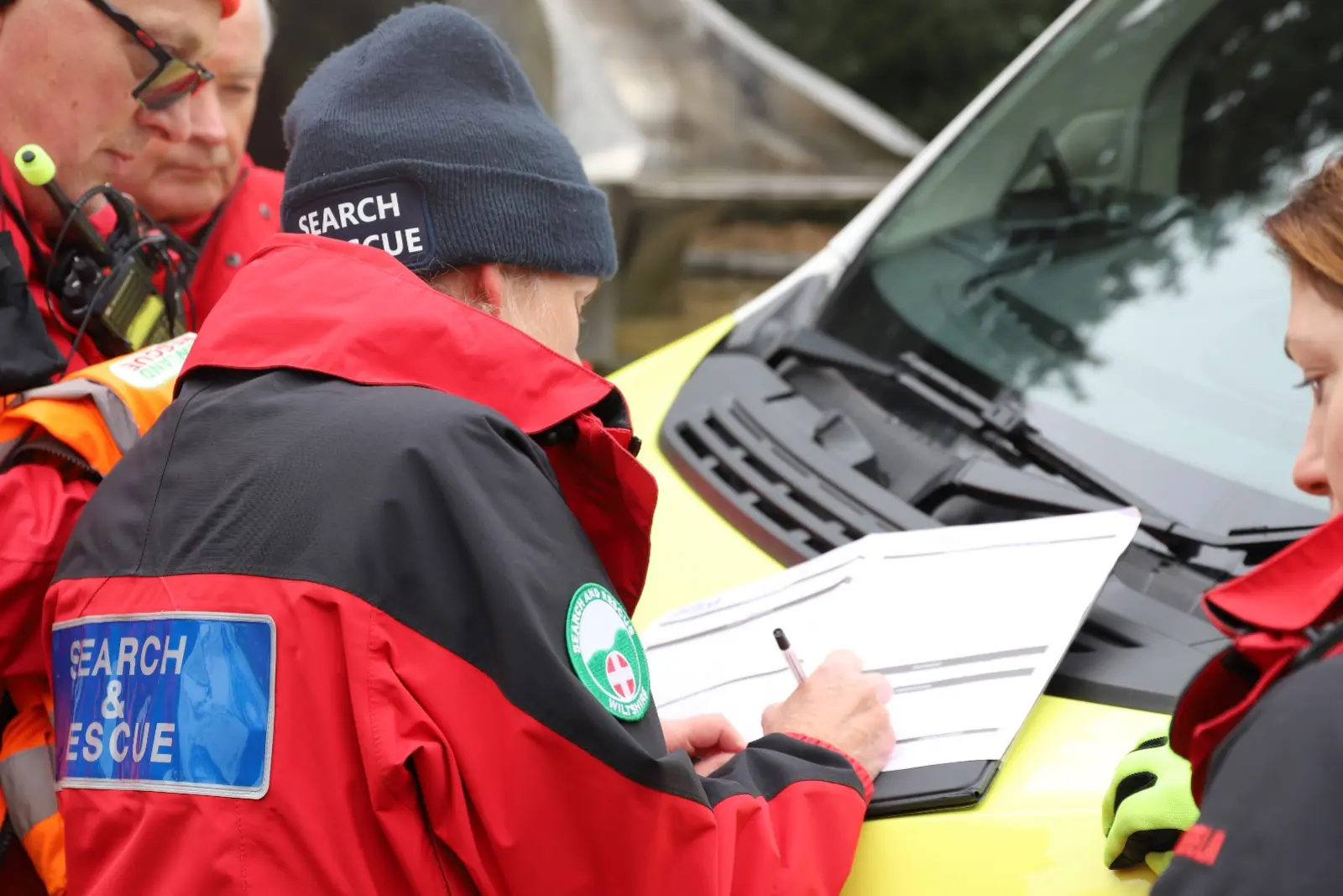 Team members giving a debrief