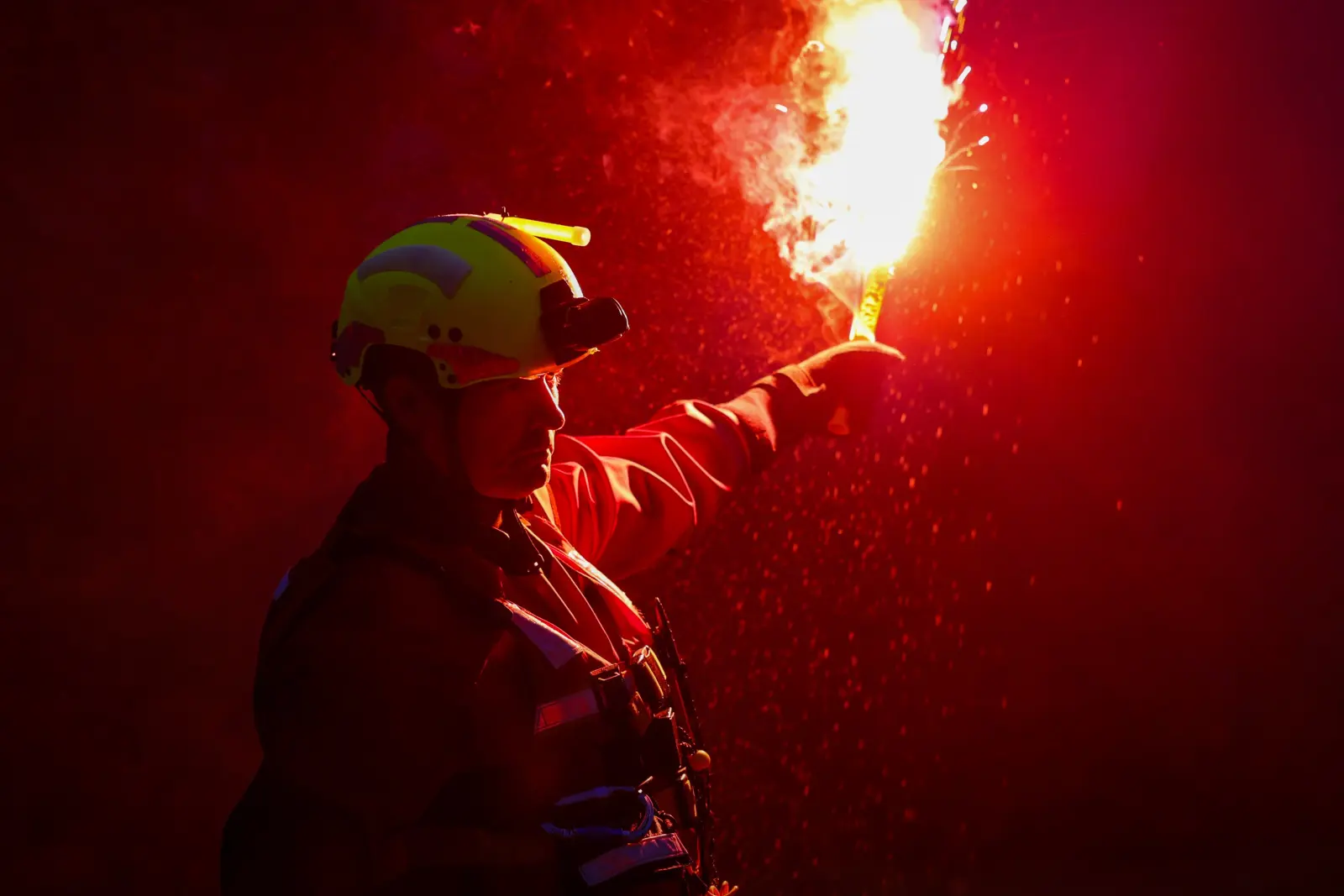 Search Technician hold a flare